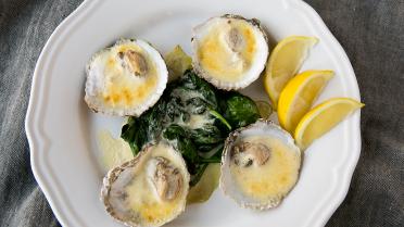 Oesters in champagnesaus met spinazie